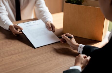 Executive Signing On Resignation Letter For Male Employee When Quitting Job And Changing New Job