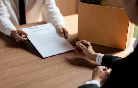 Executive Signing On Resignation Letter For Male Employee When Quitting Job And Changing New Job